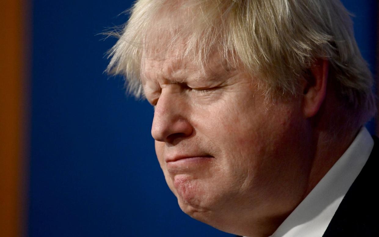 Prime Minister Boris Johnson reacts as he addresses the media regarding the United Kingdom's Covid-19 infection rate and vaccination campaign - Leon Neal/Getty Images Europe