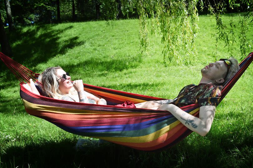 Glasgow's Kelvingrove Park as people relax and enjoy the sunshine.