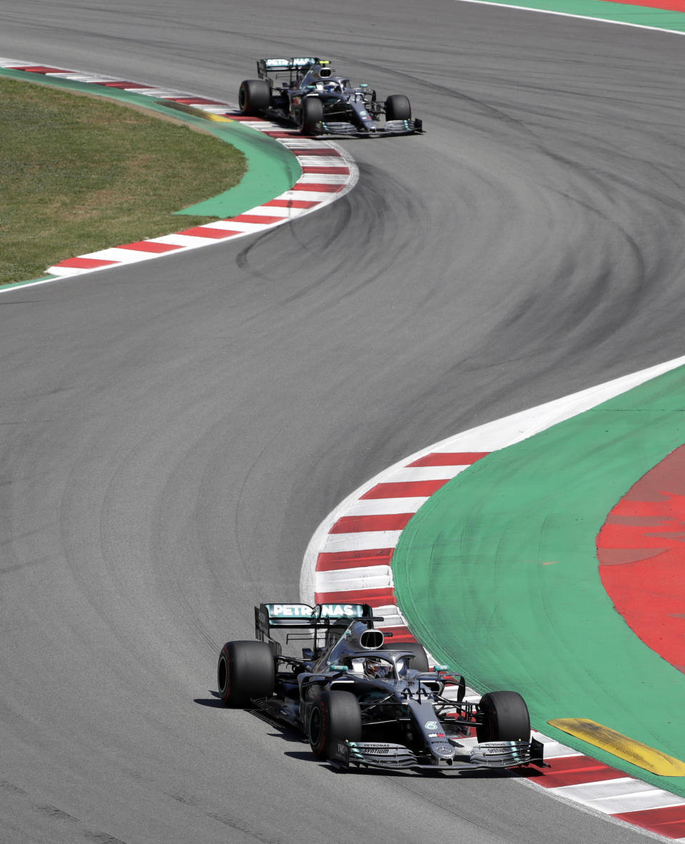 Mercedes driver Lewis Hamilton of Britain leads his teammate Mercedes driver Valtteri Bottas of Finland during the Spanish Formula One race at the Barcelona Catalunya racetrack in Montmelo, just outside Barcelona, Spain, Sunday, May 12, 2019. (AP Photo/Emilio Morenatti)