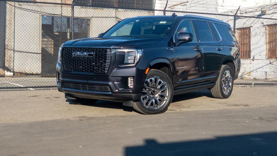 a black car parked in front of a building