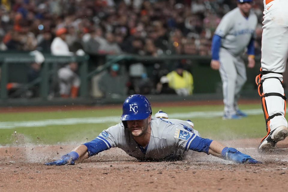 Kansas City Royals' Andrew Benintendi scores against the San Francisco Giants during the eighth inning of a baseball game in San Francisco, Tuesday, June 14, 2022. (AP Photo/Jeff Chiu)