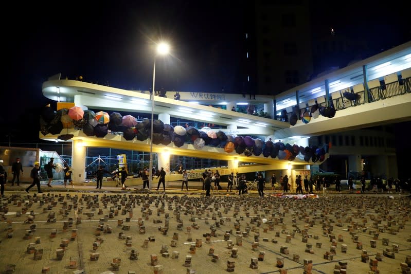 FILE PHOTO: Stones are seen scattered on the road to prevent the police from getting to the occupied campus of the Baptist University in Hong Kong, China