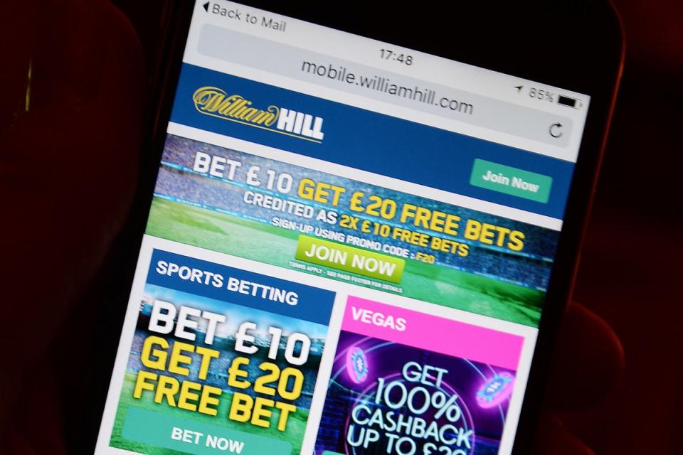 A smartphone user accesses the William Hill gambling website (PA Archive)