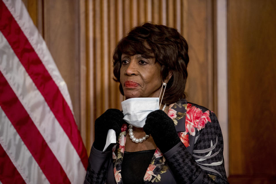 FILE - In this April 23, 2020, file photo House Financial Services Committee Chairwoman Maxine Waters, takes her mask off to speak during a signing ceremony for the Paycheck Protection Program and Health Care Enhancement Act, H.R. 266, after it passed the House on Capitol Hill, in Washington. Maxine Waters said she started focusing on police violence in 1979 after Los Angeles police shot a Black homemaker, Eula Love, during a confrontation over an unpaid gas bill. (AP Photo/Andrew Harnik, File)