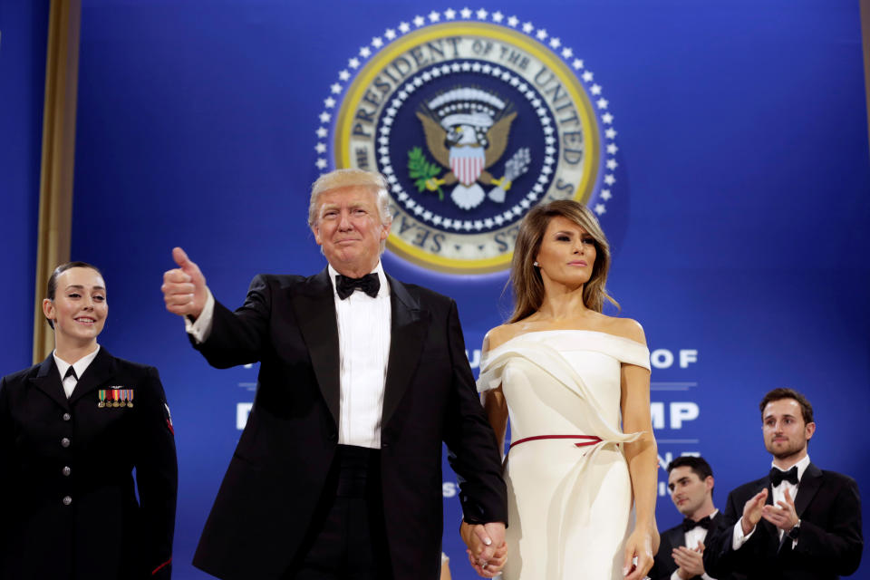 President Trump salutes with first lady Melania Trump at the Armed Services Ball in Washington, Jan. 20, 2017. (Photo: Yuri Gripas/Reuters)