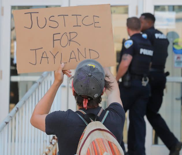 Akron Police Officers are confronted by protesters as they enter the Stubbs Justice Center during a protest over the Akron police shooting death of Jayland Walker on Thursday, June 30, 2022, in Akron, Ohio. Walkler, shot and killed by police following a vehicle and foot pursuit this week died from multiple gunshot wounds, and his death has been ruled a homicide, authorities announced Wednesday.(Jeff Lange /Akron Beacon Journal via AP) (Photo: via Associated Press)