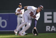 Minnesota Twins first baseman Jose Miranda scoops a grounder off the bat of Los Angeles Angels' Matt Thaiss for an out in the fifth inning of a baseball game, Sunday, Sept 25, 2022, in Minneapolis. (AP Photo/Jim Mone)