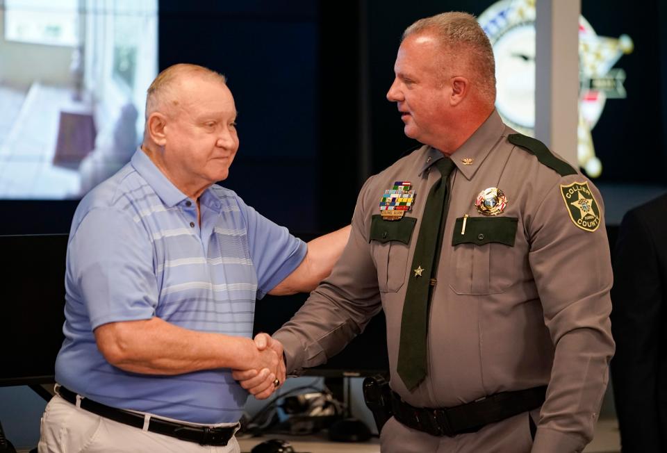 Michael Gallaway, the husband of Margaret, shakes hte hand of Col. Jim Bloom, undersheriff of the Collier County Sheriff’s Office, during an update on his wife, who was found six days after being declared missing, at the Collier County Sheriff's Office in Naples on Monday, Oct. 23, 2023.
