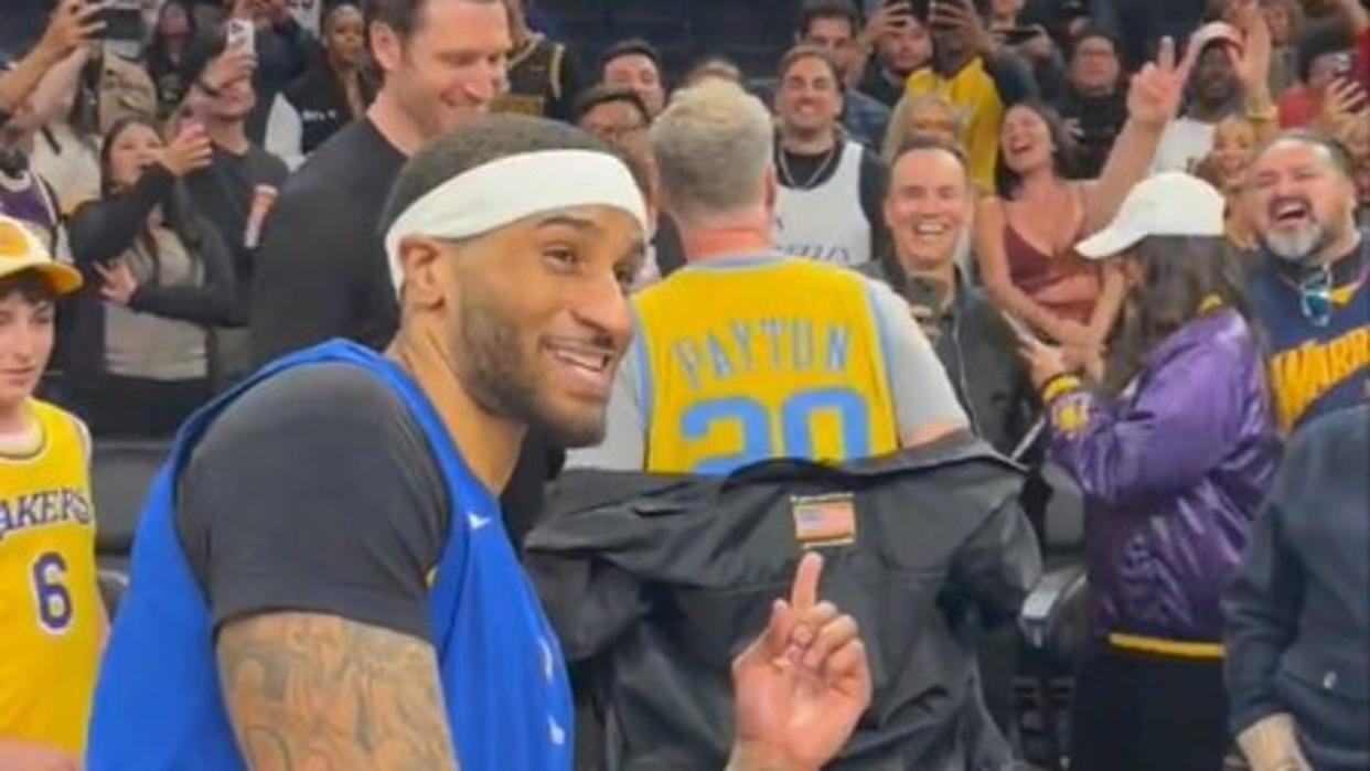 <div>Gary Payton II points to a vintage Gary Payton jersey worn by actor Will Ferrell.</div> <strong>(Golden State Warriors)</strong>