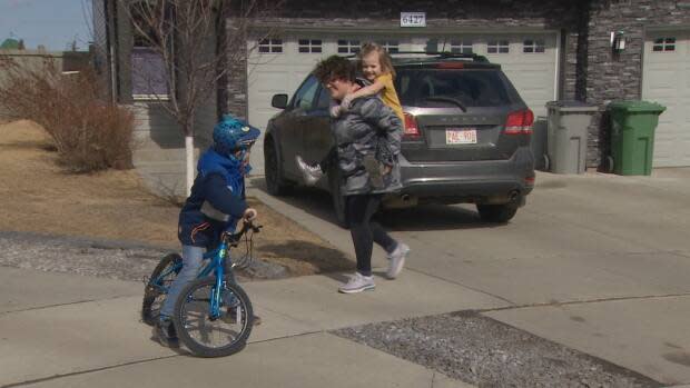 Taylor Schroeter, who lives in Beaumont, plays with her two young children on March 30, 2021. She says during the pandemic, parents have been more engaged than ever in their children's education, which will make them particularly sensitive to the substantial changes proposed to the K-6 school curriculum.