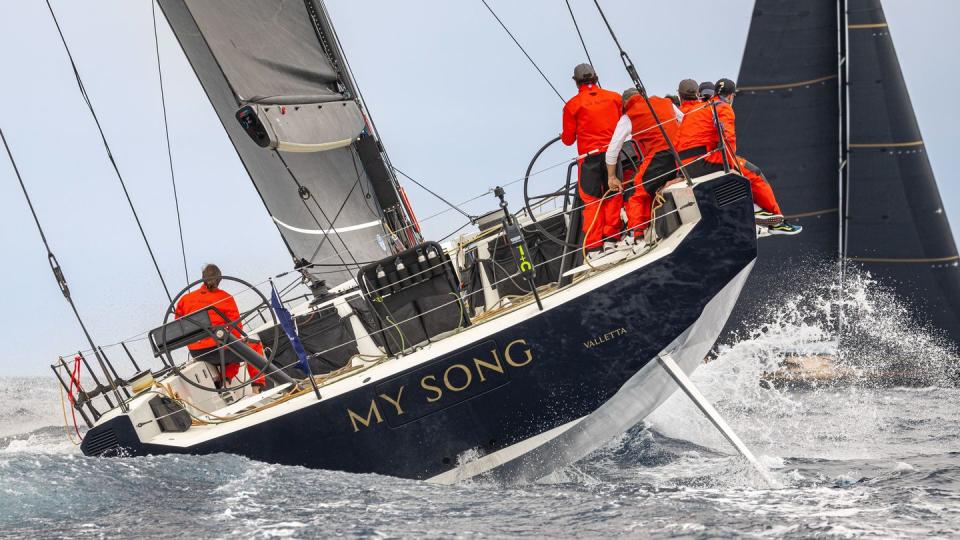 a group of people on a sailboat