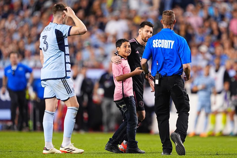 A young fan rushed the field to meet Lionel Messi during the Inter Miami-Sporting KC game.