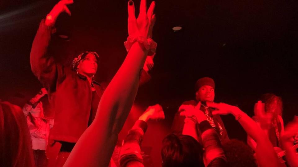 Rappers Yel (left) and Topp (center) stand on stage above screaming fans, joined by the AFFILI8D guitarist, Collin Jay (right), at Ray’s Golden Lion.