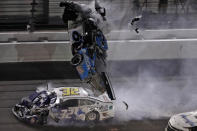 Ryan Newman (6) goes airborne after crashing into Corey LaJoie (32) during the NASCAR Daytona 500 auto race Monday, Feb. 17, 2020, at Daytona International Speedway in Daytona Beach, Fla. Sunday's running of the race was postponed by rain. (AP Photo/Chris O'Meara)