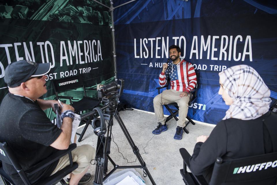 Hassan Sheikh (center) is interviewed during HuffPost's visit to Detroit.