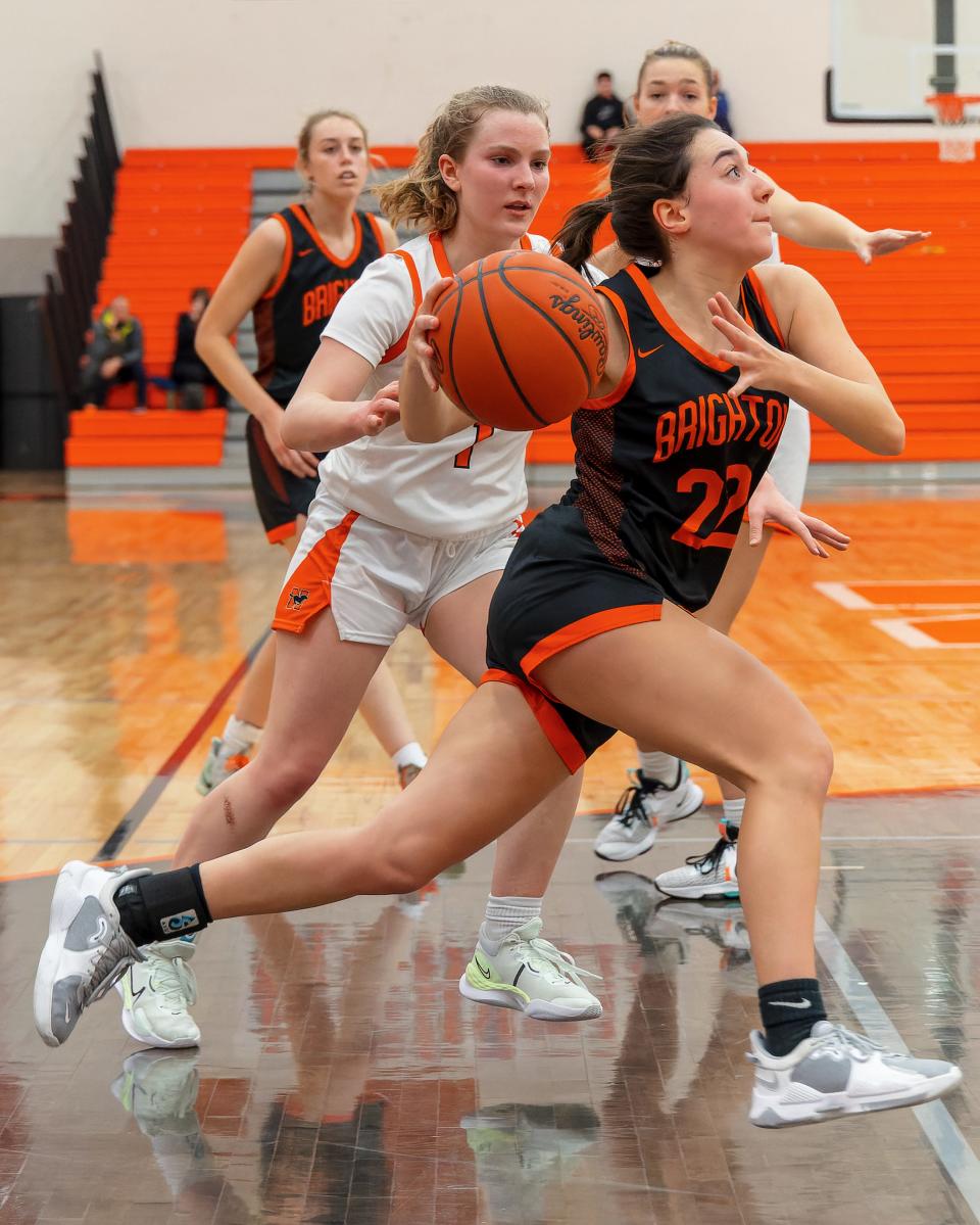 Brighton's Payton VanDeven drives toward the basket while defended by Northville's Lauren Talcott during the Bulldogs' 43-41 victory on Friday, Jan. 13, 2023.