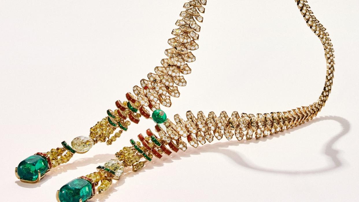 a gold necklace with beads