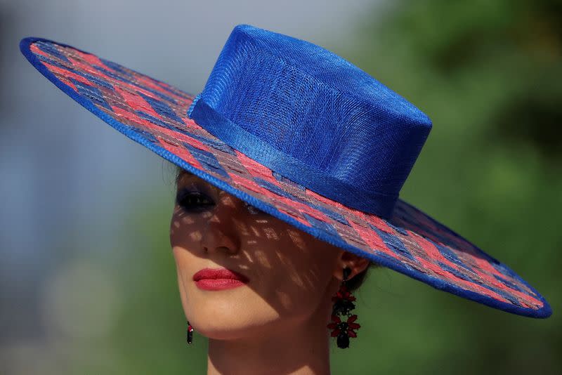 FILE PHOTO: A model presents a creation by Russian designer Slava Zaitsev at the Moscow Fashion Week Russia at Zaryadye Park in central Moscow