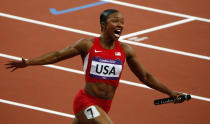 Carmelita Jeter of the U.S. celebrates after the U.S. won the women's 4x100m relay final during the London 2012 Olympic Games at the Olympic Stadium August 10, 2012. The United States won the women's 4x100 metres relay in a world record time at the London Olympics on Friday, completing the lap in a sizzling 40.82 seconds to win the title back for the first time since 1996. REUTERS/David Gray (BRITAIN - Tags: OLYMPICS SPORT ATHLETICS) 