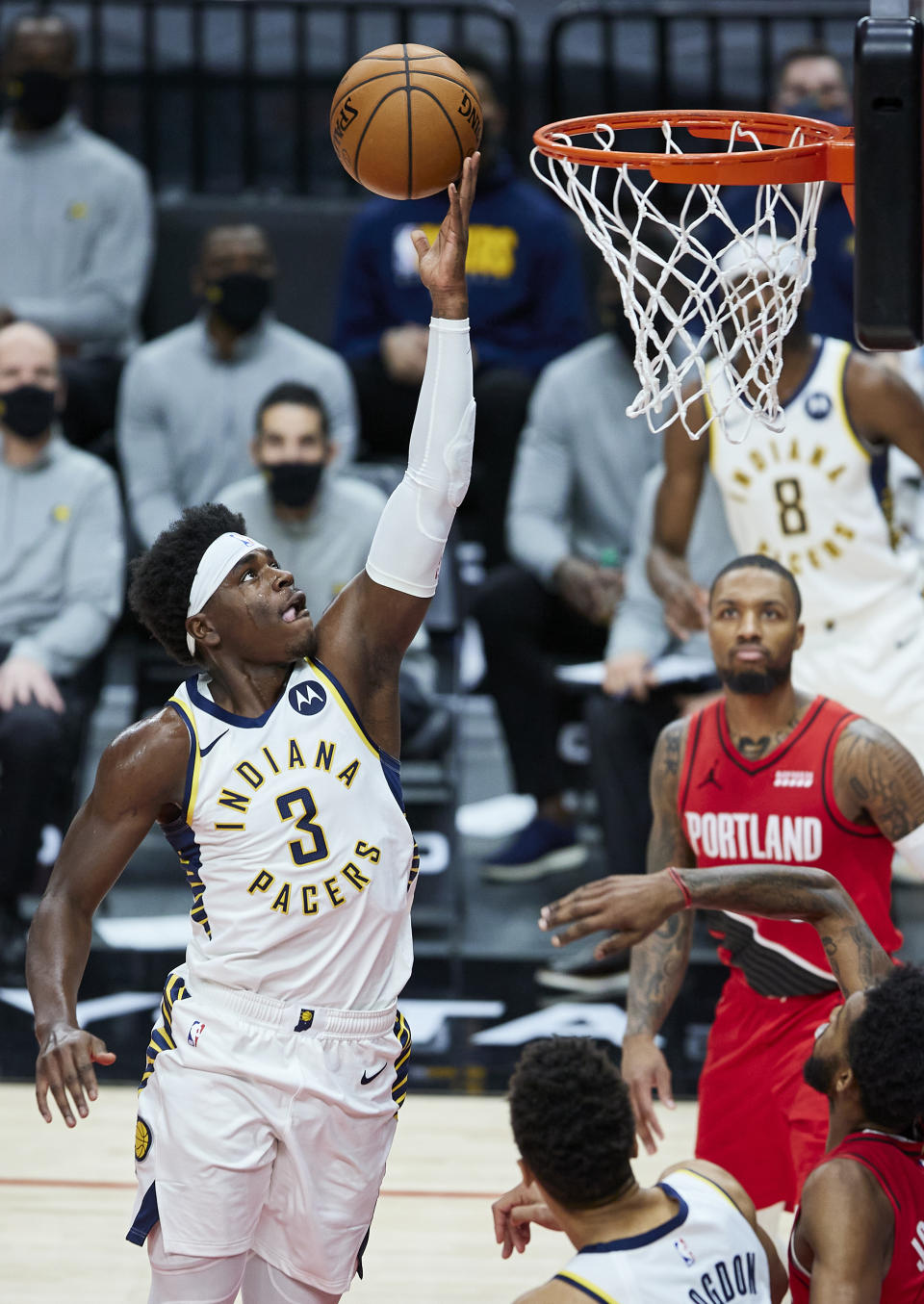 Indiana Pacers guard Aaron Holiday (3) shoots against the Portland Trail Blazers during the first half of an NBA basketball game in Portland, Ore., Thursday, Jan. 14, 2021. (AP Photo/Craig Mitchelldyer)