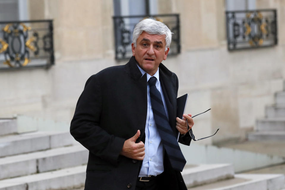 Herve Morin, President of France Regions leaves after a meeting with French President Emmanuel Macron and local, national political leaders, unions, business leaders and others to hear their concerns after four weeks of protests, at the Elysee Palace in Paris, Monday, Dec. 10, 2018. French President Emmanuel Macron is preparing to speak to the nation at last after increasingly violent "yellow vest" protests against his leadership. (AP Photo/Francois Mori)