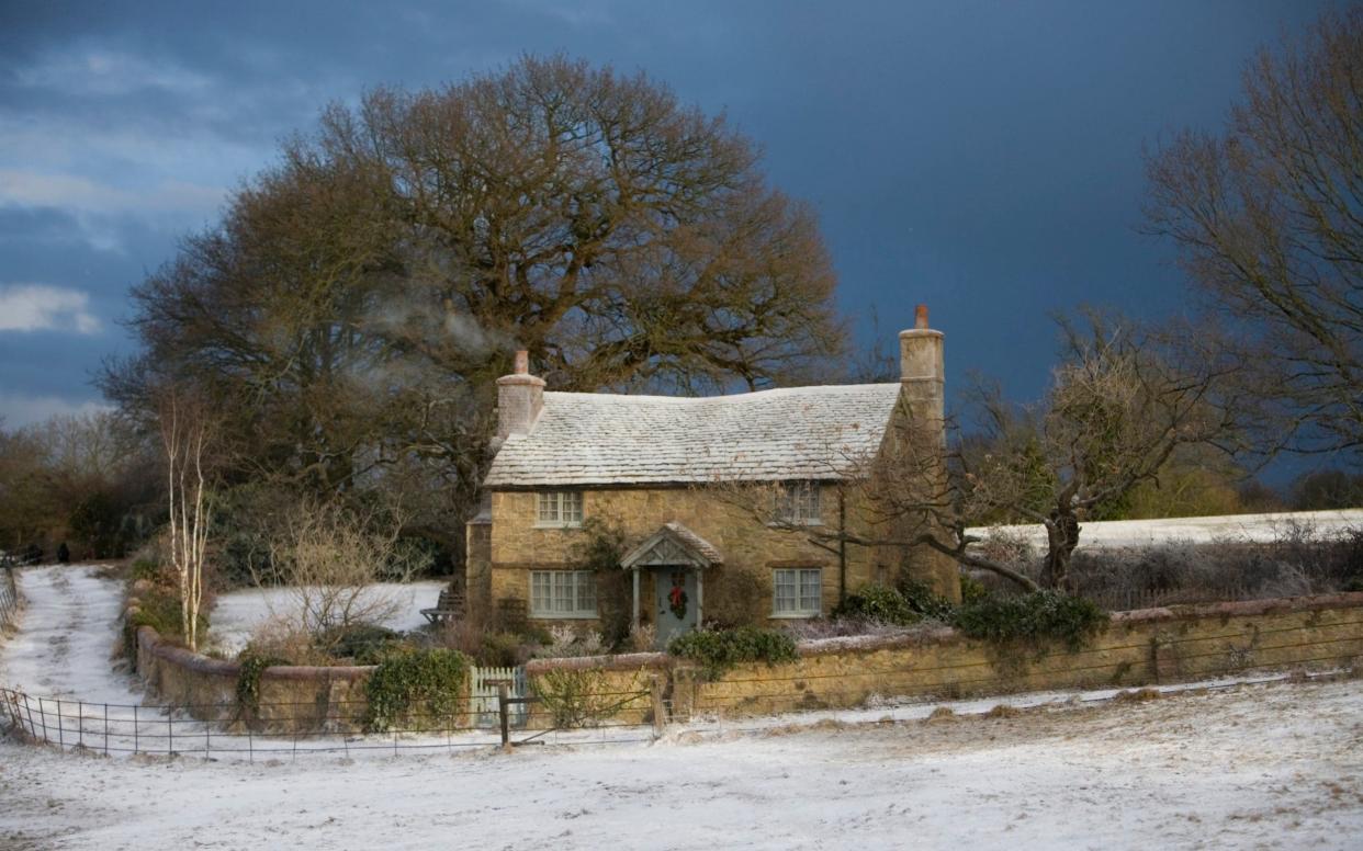As the weather turns colder, the nation starts to wonder - will there be a white Christmas? Pictured, the snow-covered English cottage which featured in the film The Holiday - Film Stills