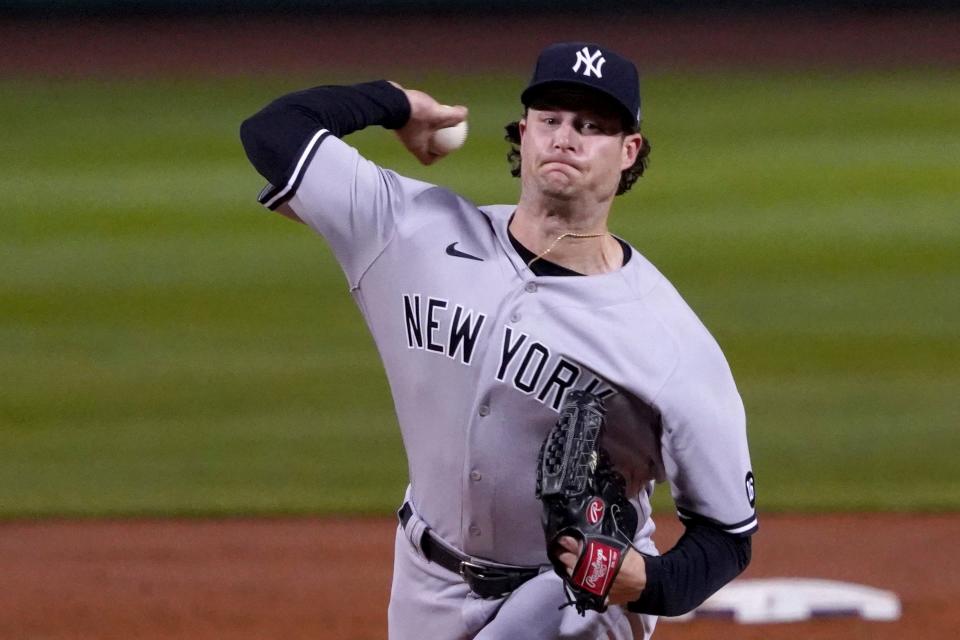 New York Yankees starting pitcher Gerrit Cole (45) throws to a Boston Red Sox batter during the first inning of a baseball game at Fenway Park, Friday, Sept. 24, 2021, in Boston. (AP Photo/Mary Schwalm)