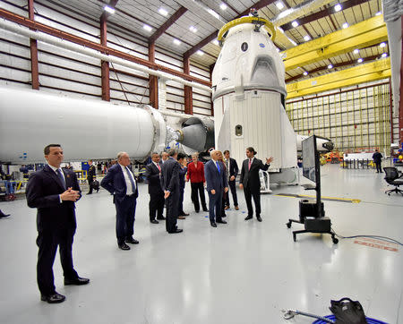 U.S. Vice President Mike Pence tours the SpaceX hangar at Launch Complex 39-A where the Dragon crew module and Falcon 9 booster rocket are being prepared for a January 2019 launch at Cape Canaveral, Florida, U.S. December 18, 2018. REUTERS/Steve Nesius