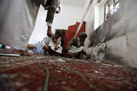 People inspect damage caused by a bomb explosion at a mosque in Yemen's capital Sanaa May 22, 2015. REUTERS/Khaled Abdullah