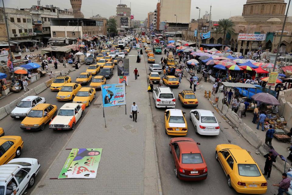 In this photo taken on Sunday, April 27, 2014, cars stand still in a traffic jam in central Baghdad, Iraq. As parliamentary elections are held Wednesday, April 30, more than two years after the withdrawal of U.S. troops, Baghdad is once again a city gripped by fear and scarred by violence. (AP Photo/Karim Kadim)