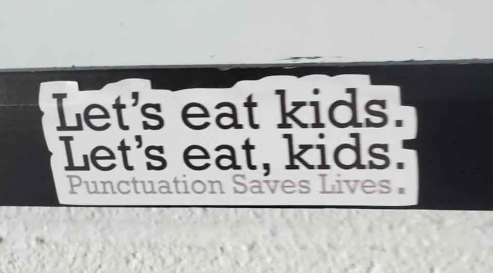 Sign: "Let's eat kids; Let's eat, kids: Punctuation Saves Lives"