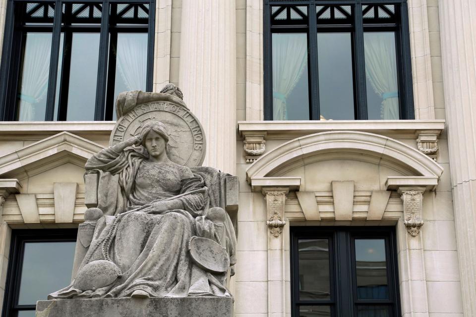 This Aug. 27, 2014, file photo shows a statue outside of the Illinois Supreme Court building in Springfield. The Illinois Supreme Court upheld the constitutionality of a state law ending cash bail, ordering implementation in on Sept. 18.