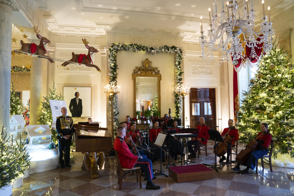 Holiday decorations adorn the Grand Foyer of the White House for the 2023 theme "Magic, Wonder, and Joy," Monday, Nov. 27, 2023, in Washington. (AP Photo/Evan Vucci)