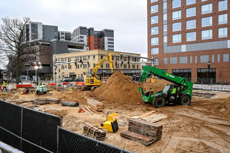 Construction crews work at the site of the MSU Federal Credit Union downtown office at 311 Abbot Road on Wednesday, Dec. 22, 2021, in East Lansing.