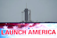 The SpaceX Falcon 9, with the Crew Dragon spacecraft on top of the rocket, sits on Launch Pad 39-A Monday, May 25, 2020, at Kennedy Space Center, Fla. Two astronauts will fly on the SpaceX Demo-2 mission to the International Space Station scheduled for launch on May 27. (AP Photo/David J. Phillip)