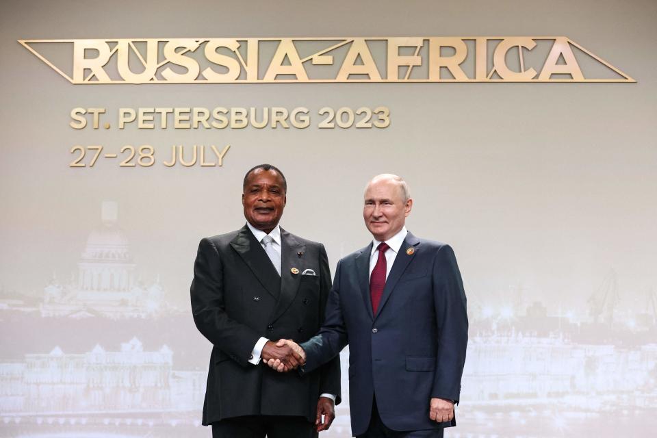 Russian President Vladimir Putin greets Congolese President Denis Sassou Nguesso (TASS Host Photo Agency/AFP via G)