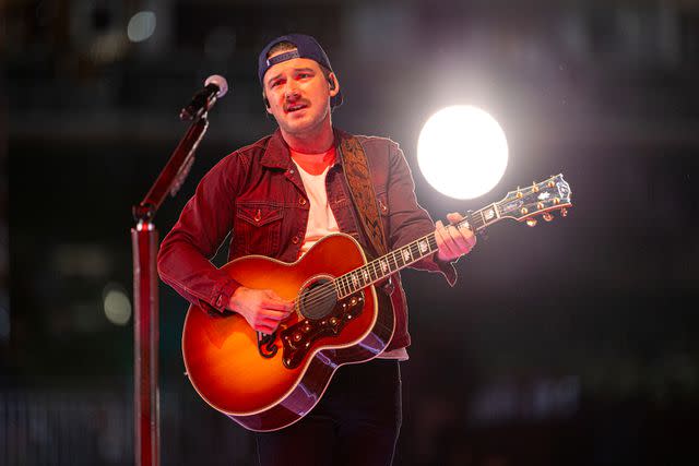 <p> Christopher Polk/Penske Media via Getty </p> Morgan Wallen performs in Atlanta in November 2023