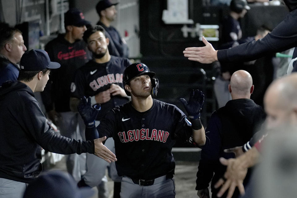 Cleveland Guardians' Tyler Freeman is greeted in the dugout after his home run off Chicago White Sox starting pitcher Garrett Crochet during the seventh inning of a baseball game Friday, May 10, 2024, in Chicago. (AP Photo/Charles Rex Arbogast)
