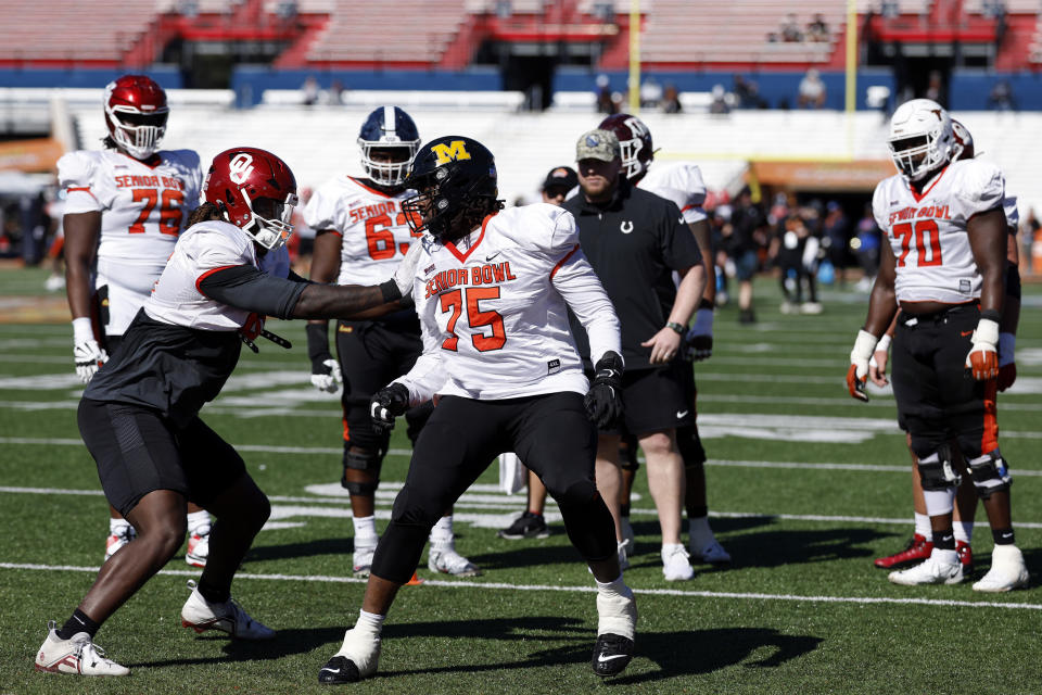 American offensive lineman Javon Foster of Missouri (75) and American offensive lineman Andrew Raym of Oklahoma (73) run through drills during practice for the Senior Bowl NCAA college football game, Wednesday, Jan. 31, 2024, in Mobile, Ala. (AP Photo/ Butch Dill)