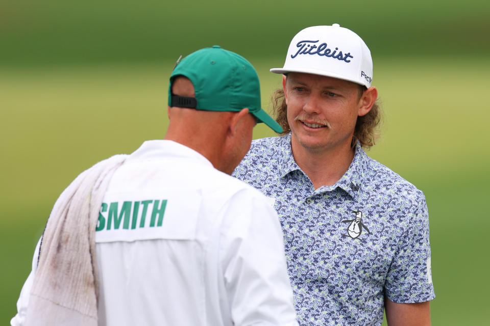 Seen here, Cameron Smith talking with his caddie Sam Pinfold during Masters practice.