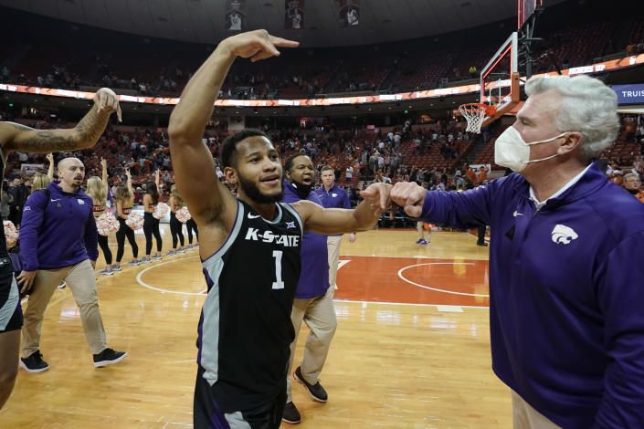Kansas State coach Bruce Weber, right, celebrated with guard Markquis Nowell after the team's win in an NCAA college basketball game against Texas, Tuesday, Jan. 18, 2022, in Austin, Texas. (AP Photo/Eric Gay)