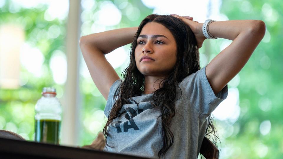 Zendaya wearing a grey t-shirt in a scene from Challengers