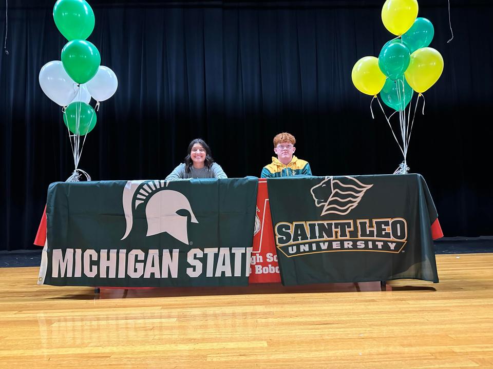 Norwayne seniors Shelby Vaughn and Logan Dichler both smile after signing their letters of intent, Vaughn to Michigan State University and Dichler to Saint Leo University.