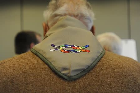 Dave Rice, founder of Scouting for All, a pro gay group, in 1993 but was subsequently kicked out of Boy Scouts after 59 years of involvement, wears a neckerchief embroidered with the Inclusive Scouting Award while talking with supporters at the Equal Scouting Summit in Grapevine, Texas May 23, 2013. REUTERS/Michael Prengler