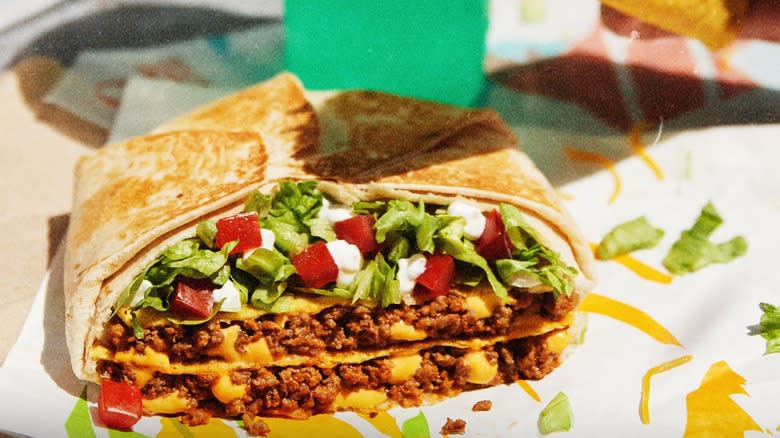 Crunchwrap with all the fillings on paper wrapper