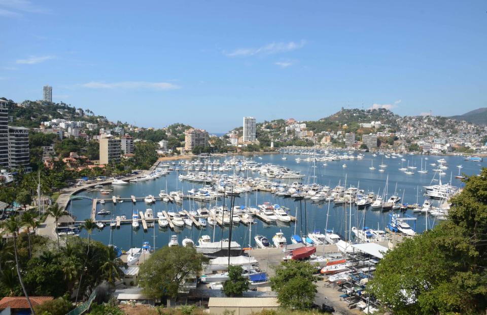 In this Tuesday, Jan. 7, 2014 photo, yachts are docked at a marina in the Bay of Acapulco, Mexico. After inspecting more than 1,600 vessels in late November, the Mexican government’s Treasury Department announced it had initiated seizure orders against hundreds of foreign boats it accused of lacking a temporary import permit which proves that the holders own their boats and promise not to leave them in Mexico or sell them here. Many boat owners say they simply weren’t around when authorities came by and slapped liens on the boats barring them from leaving Mexico, and say officials have not told them how they could remedy the situation. Foreign pleasure boat owners call this a heavy-handed crackdown over a minor permit, and they say it threatens a tourism sector Mexico has long sought to promote. (AP Photo/Bernandino Hernandez)