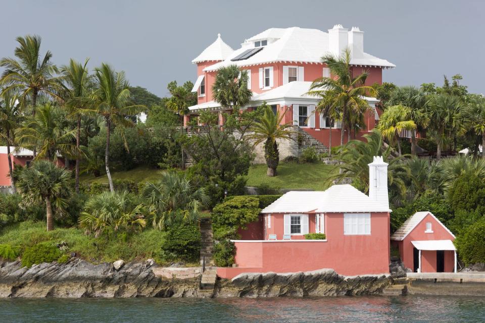 <p>A claylike pink brings a warmth to the green surroundings in Bermuda.</p>