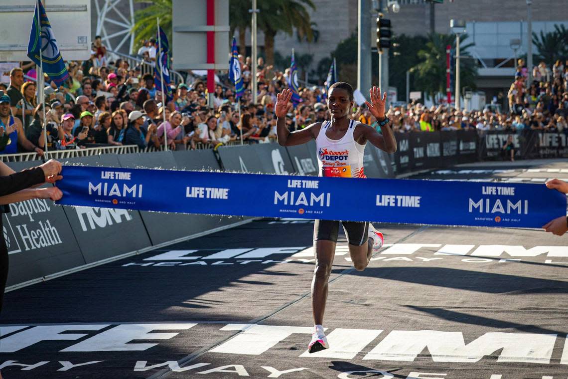 Life Time Miami Marathon women’s winner, Damaris Areba, of Kenya, crosses the finish line after completing the race on Sunday, Jan. 29, 2023, in Miami Fla.