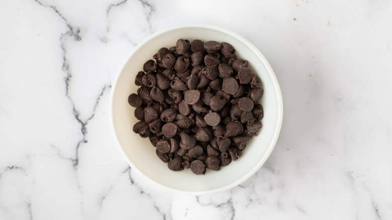 chocolate chips in white bowl