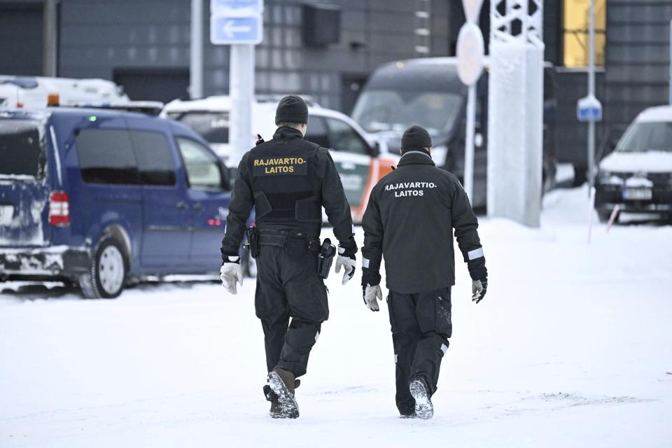 Finnish border guards are seen at the Raja-Jooseppi international border crossing station in Inari, northern Finland, Tuesday Nov. 28, 2023. Finland will close its last remaining road border with Russia due to concerns over migration, Prime Minister Petteri Orpo said Tuesday, accusing Moscow of undermining Finland's national security. (Emmi Korhonen/Lehtikuva via AP)